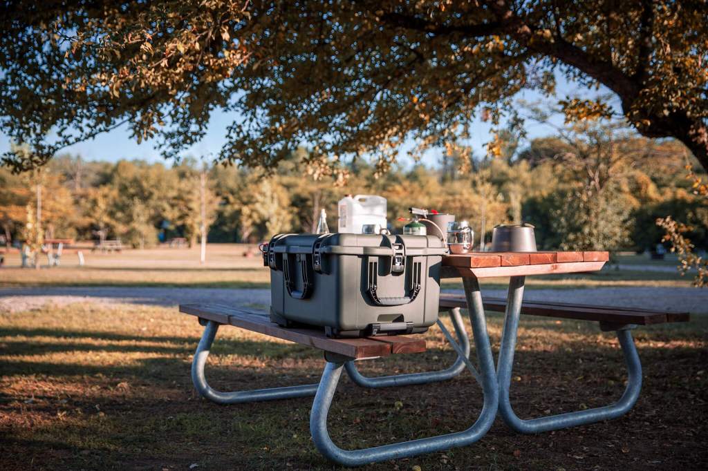 A Nanuk 960 hard case storing food at a campsite