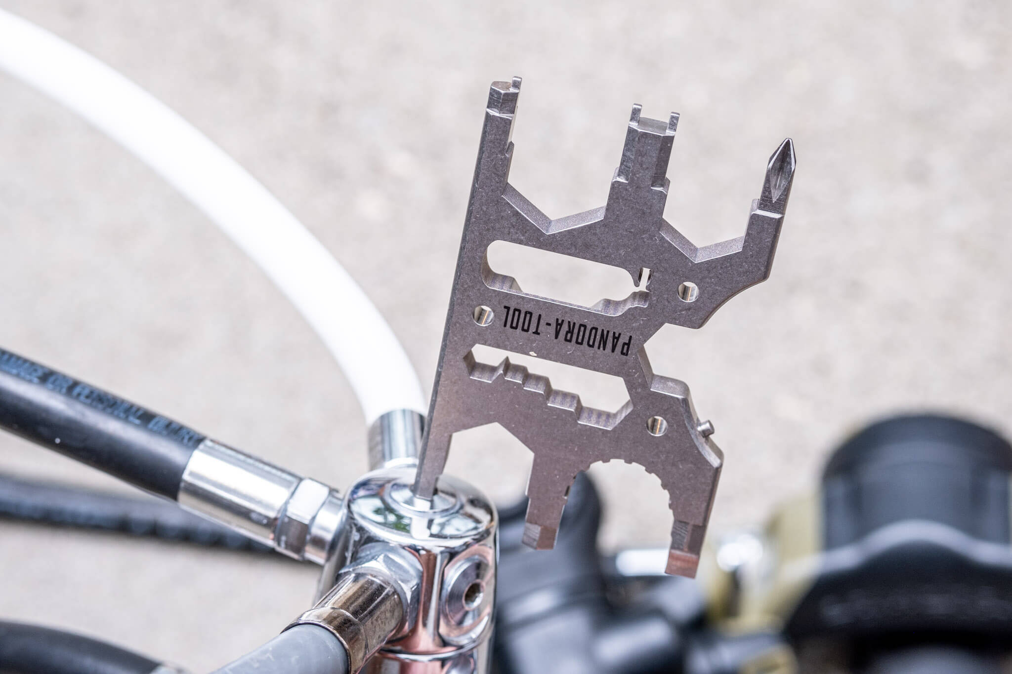 Using the Pandora Tool v3 multitool 8mm hex wrench to remove a regulator port plug