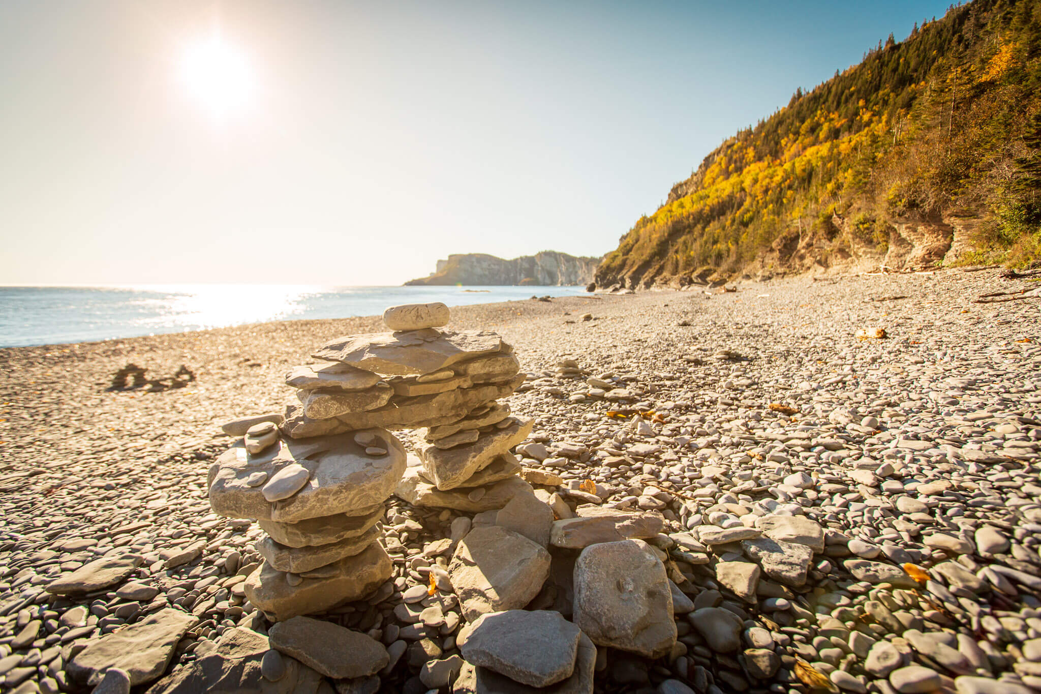 Inukshuk on the rocky shore of Cap Bon Ami in Forillon National Park