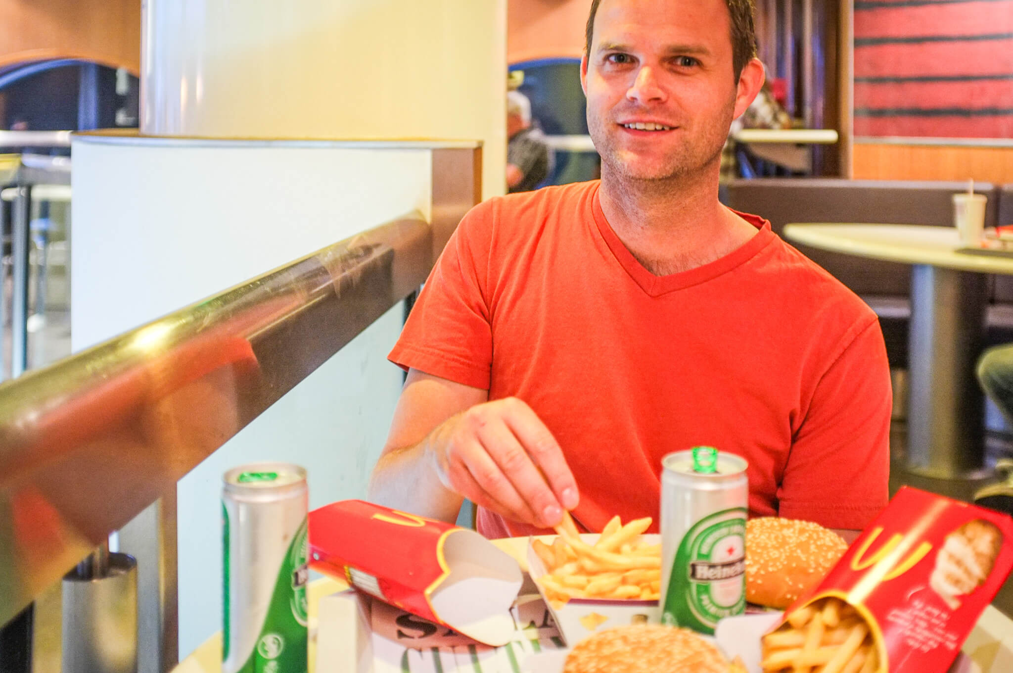 Enjoying McDonald's in Paris with Heineken beer