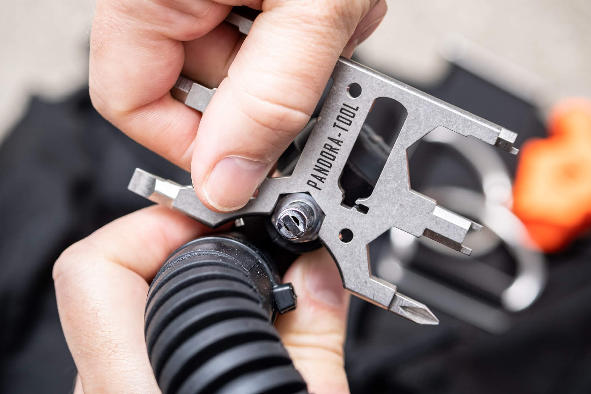 Using the Pandora Tool v3 multitool 1/2-inch spanner to tighten an inflator hose connector