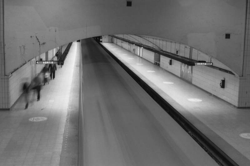 Rosemont subway station interior with moving train