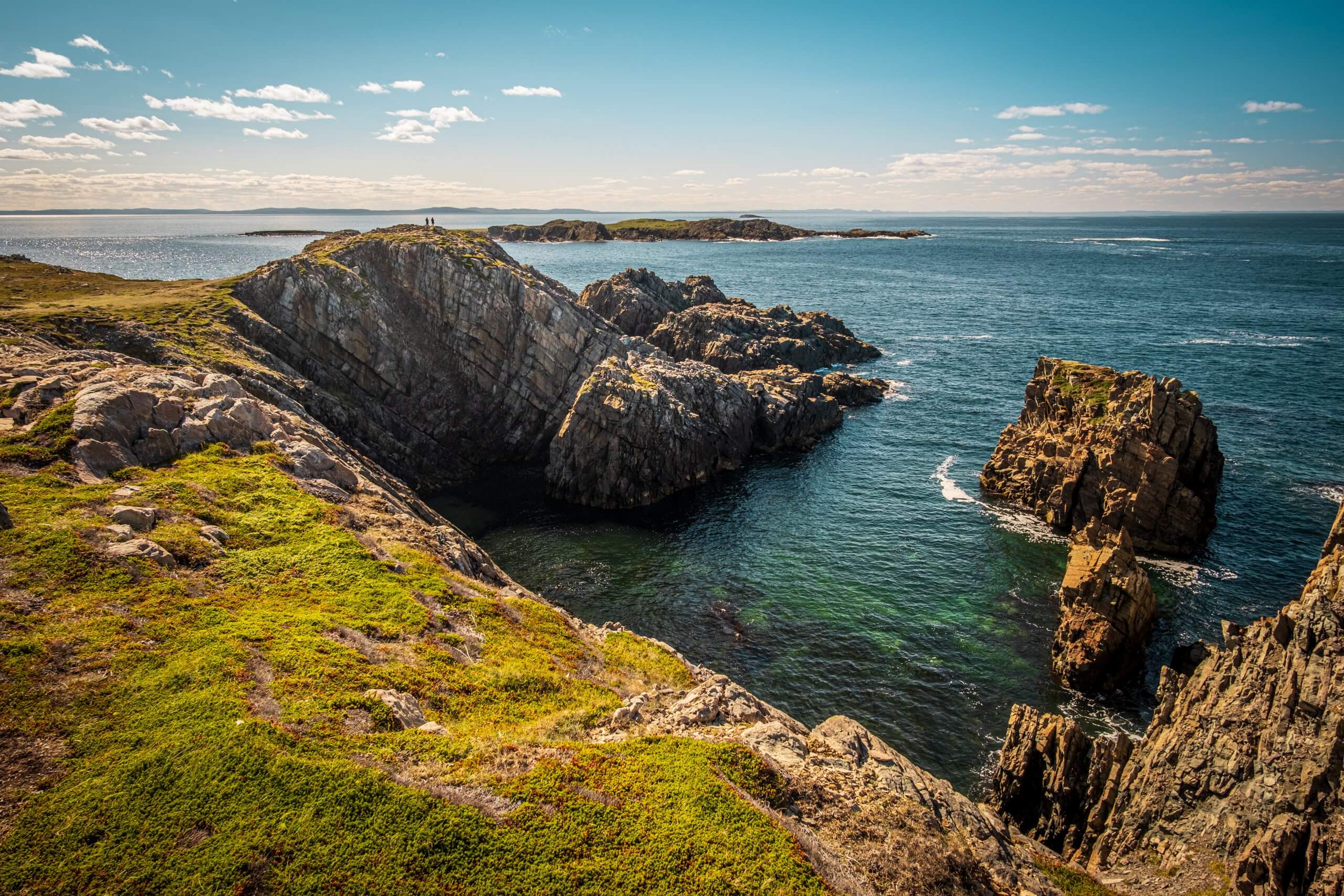 The dramatic stone cliffs and clear blue waters at Cape Bonavista, Newfoundland
