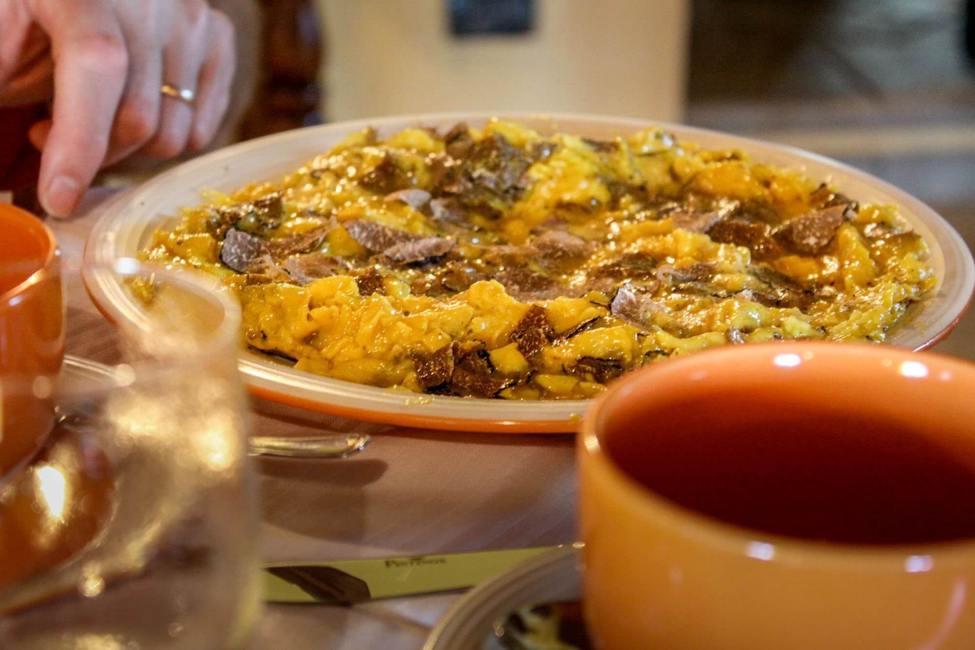 Scrambled eggs with fresh black truffle at Country House Sant'Angiolino near Urbana, Marche, Italy