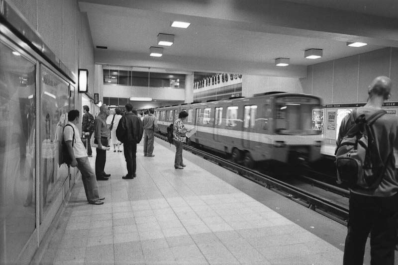 Berri-UQAM subway station interior with departing train