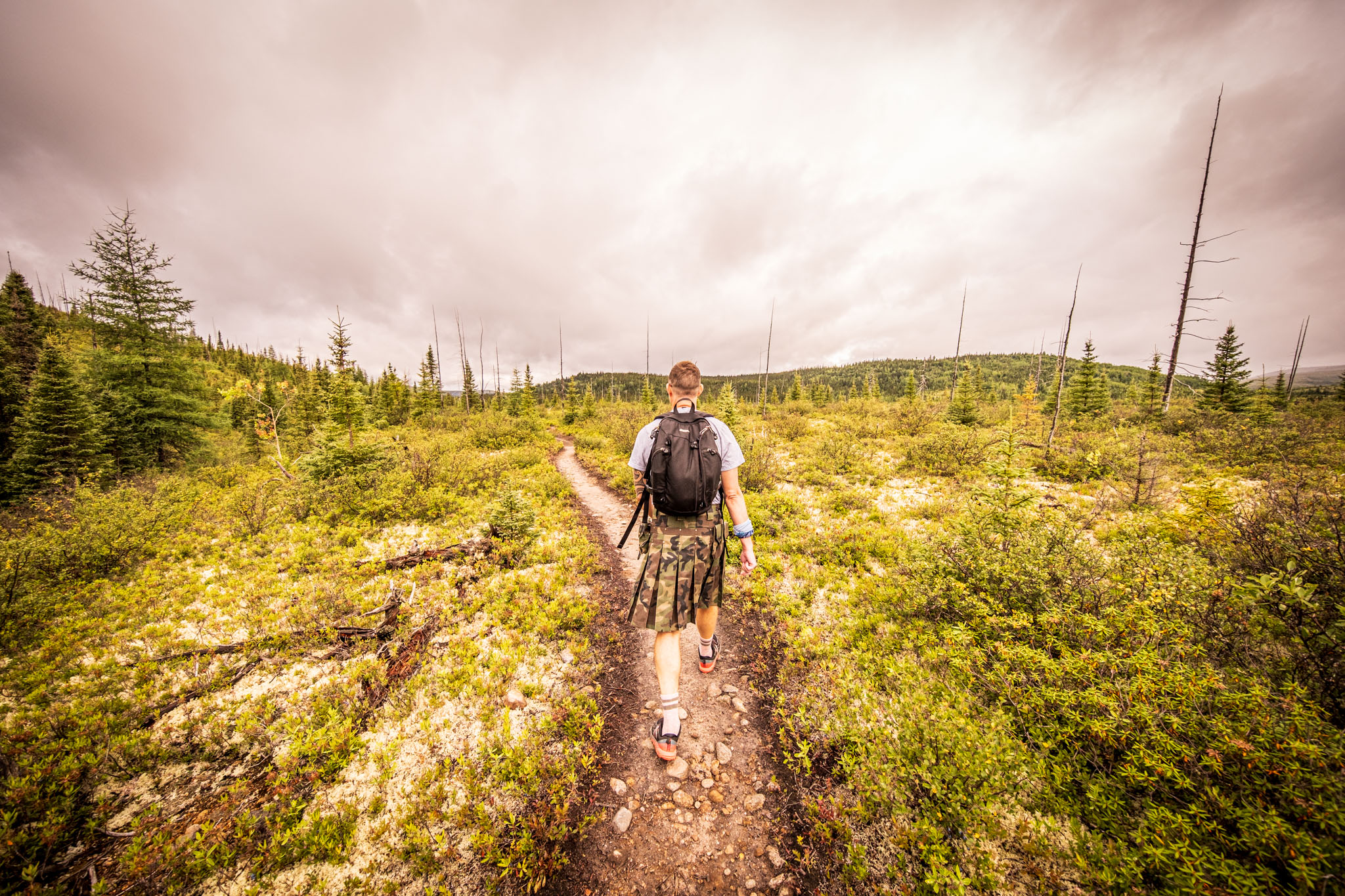 Hiker in a kilt on the Le Boréal trail at Parc national des Grands-Jardins