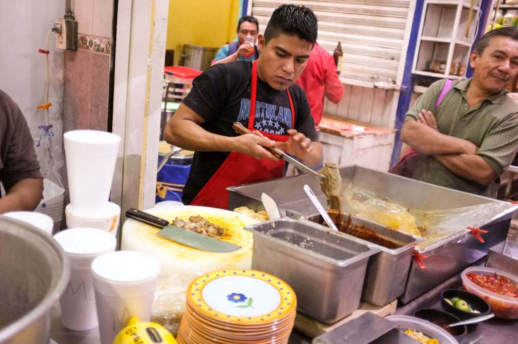 Freshly-prepared tacos birria at La Merced market