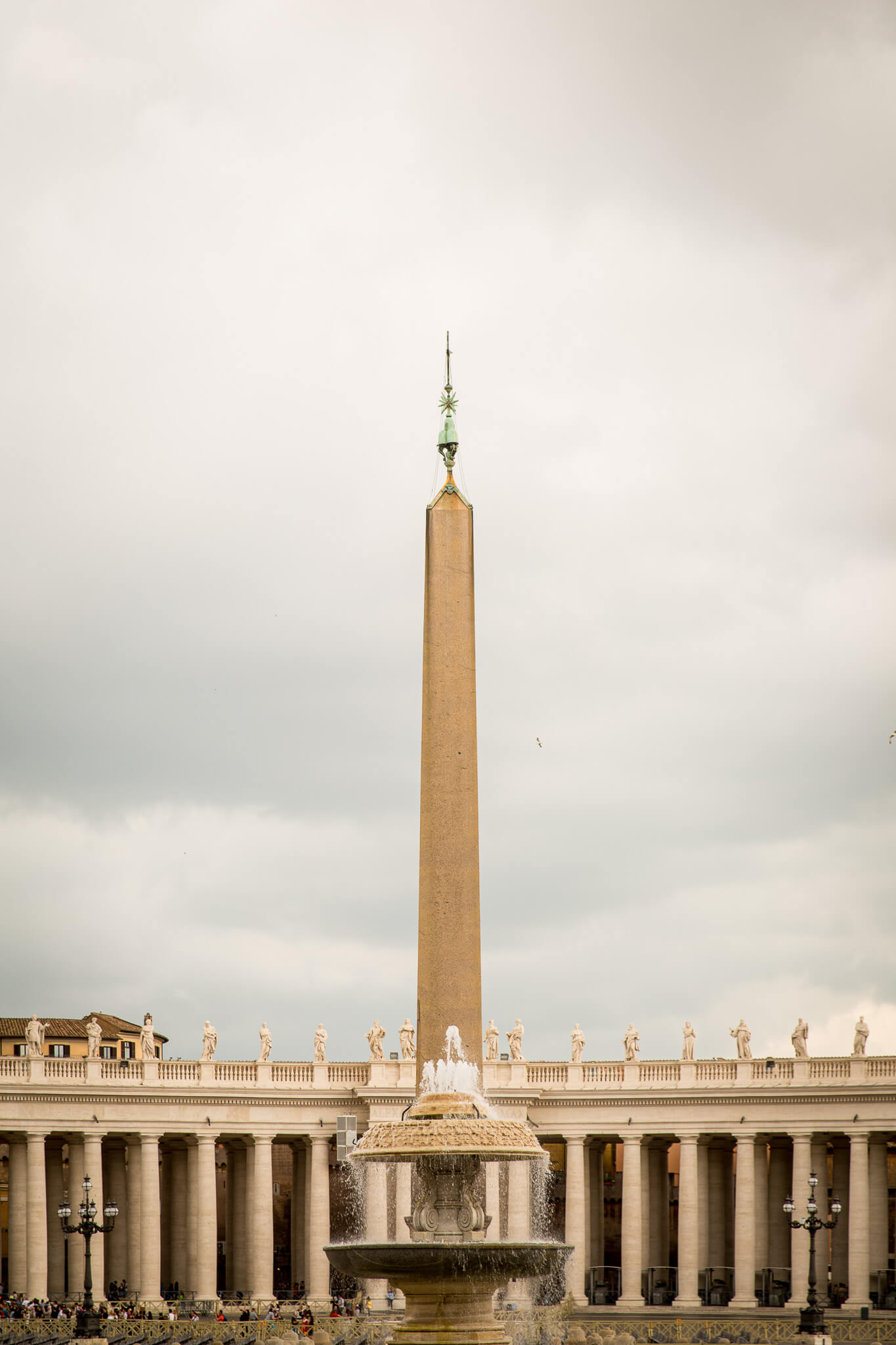 The Vatican Obelisk in front of the colonnade of Saint Peter's Square