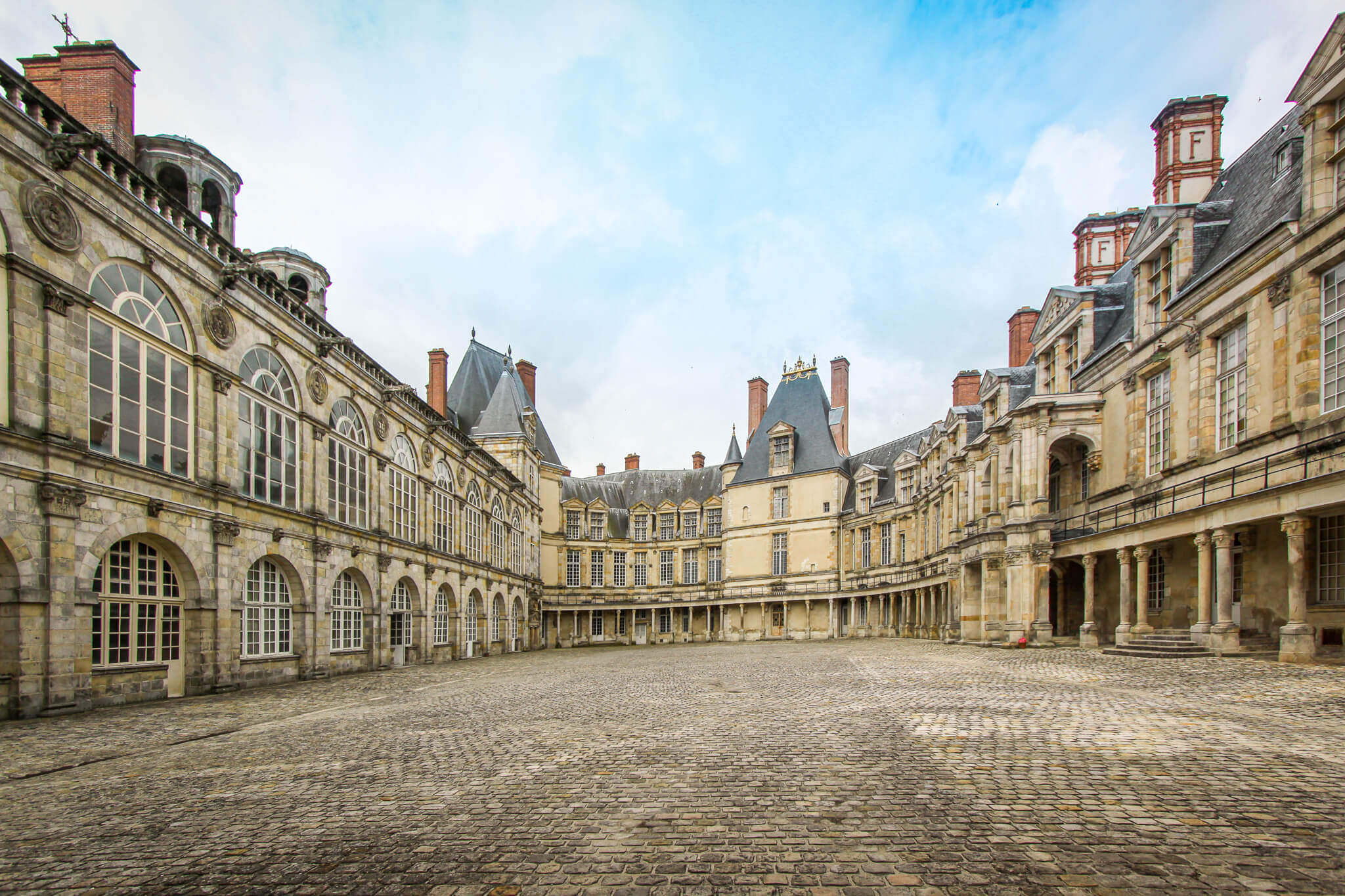 The Renaissance-style Cour Ovale with medieval donjon at Château de Fontainebleau