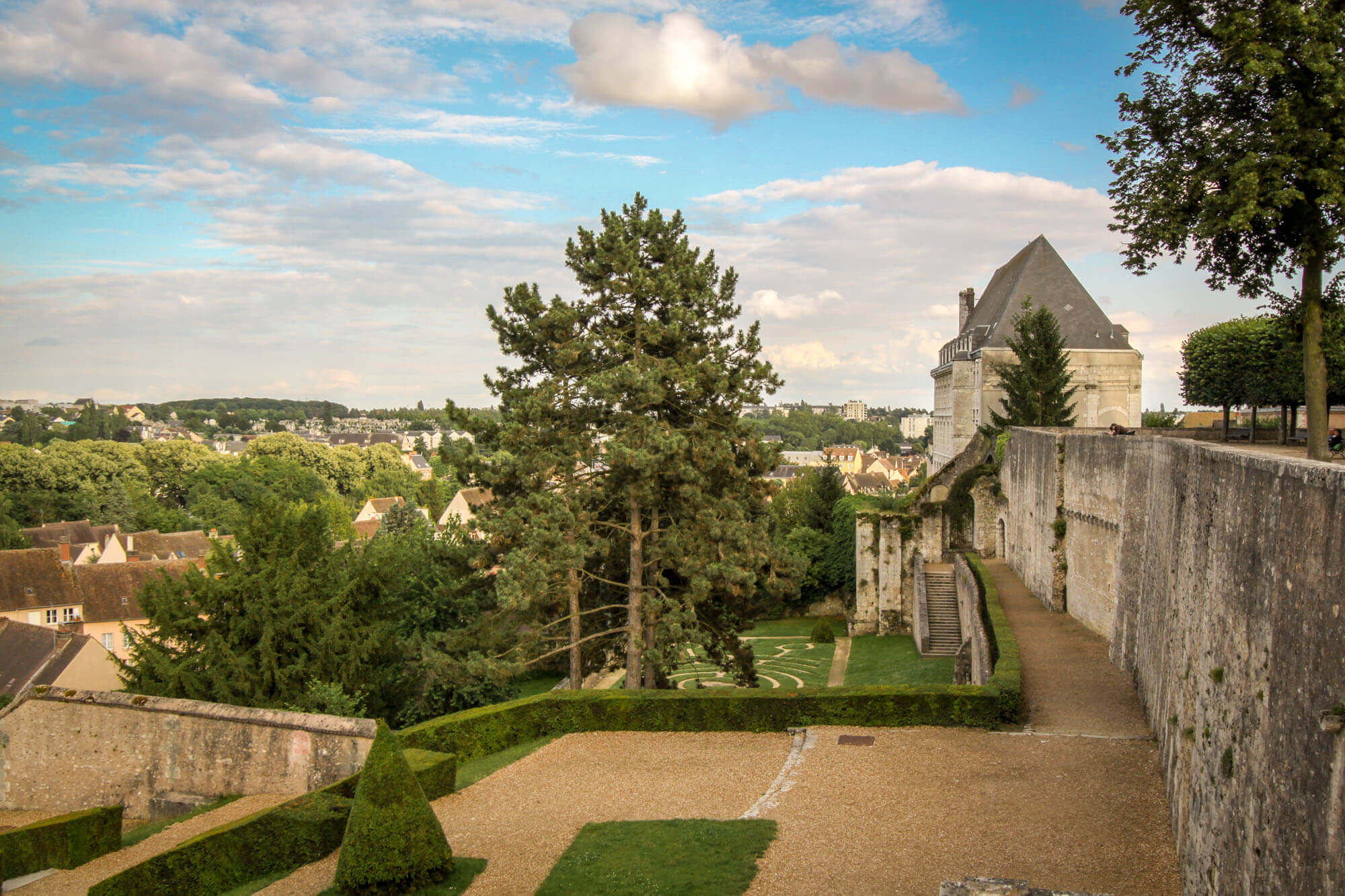 Gardens behind the Chartres Cathedral, with Hôtellerie Saint-Yves and the city of Chartres in the background