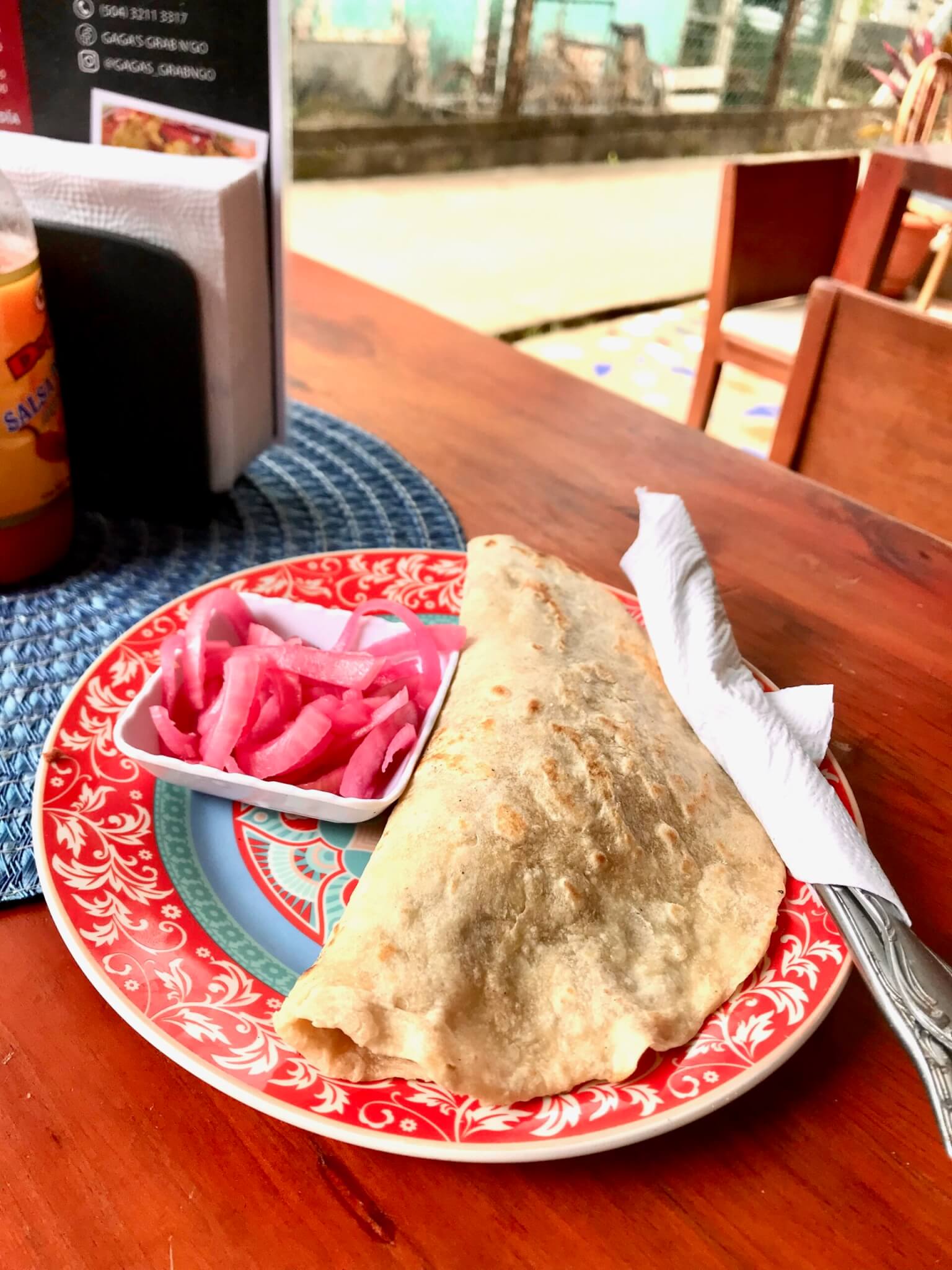 Egg baleada with pickled onions from Gaga's Grab N'Go in Utila