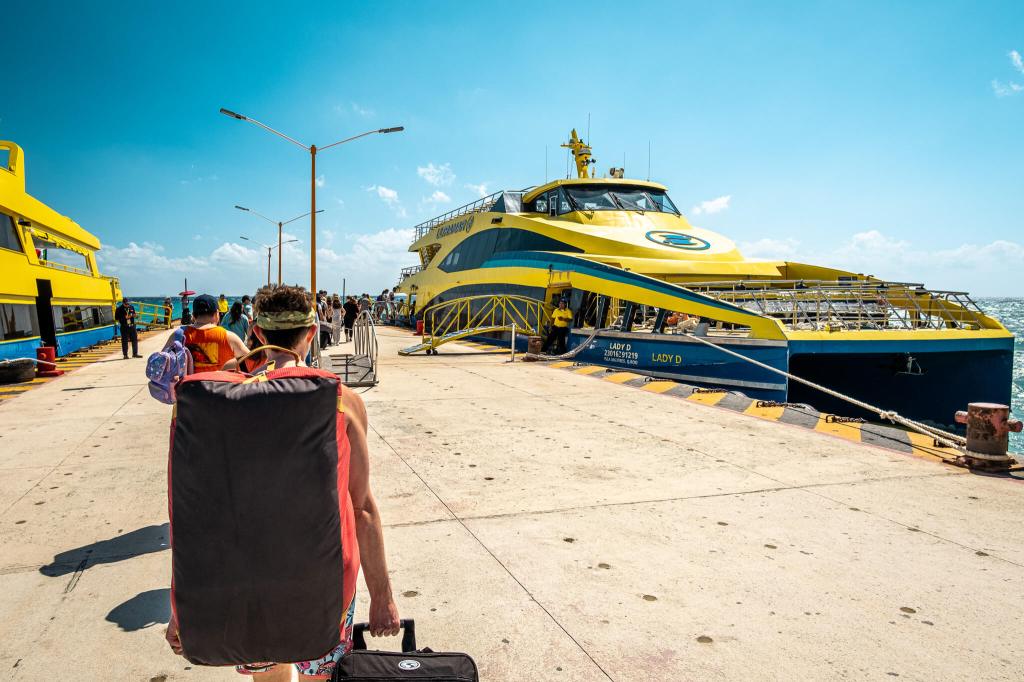 Travellers boarding the Ultramar fast ferry in Playa del Carmen