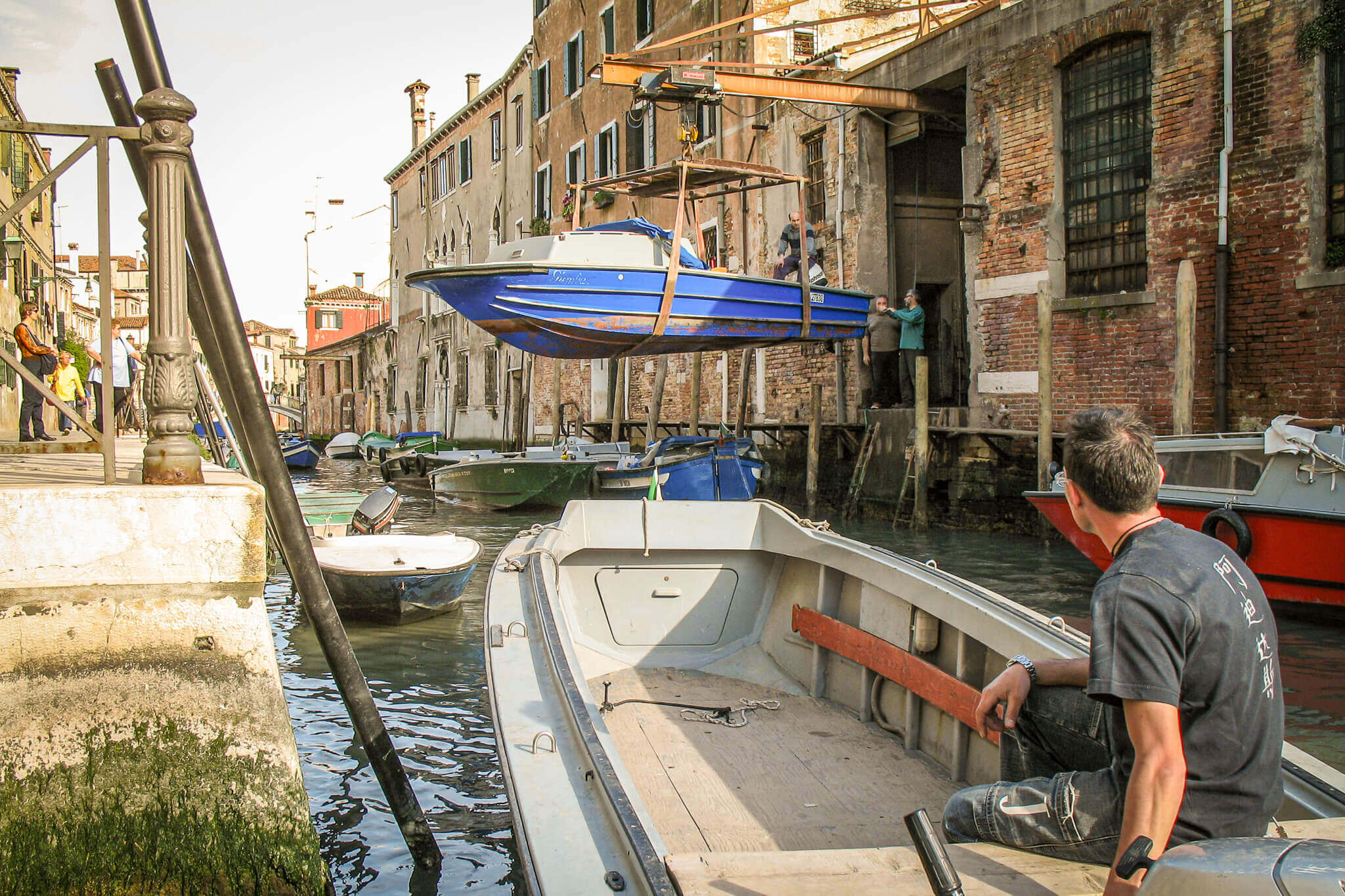 A boat being loaded into a dry dock in Venice