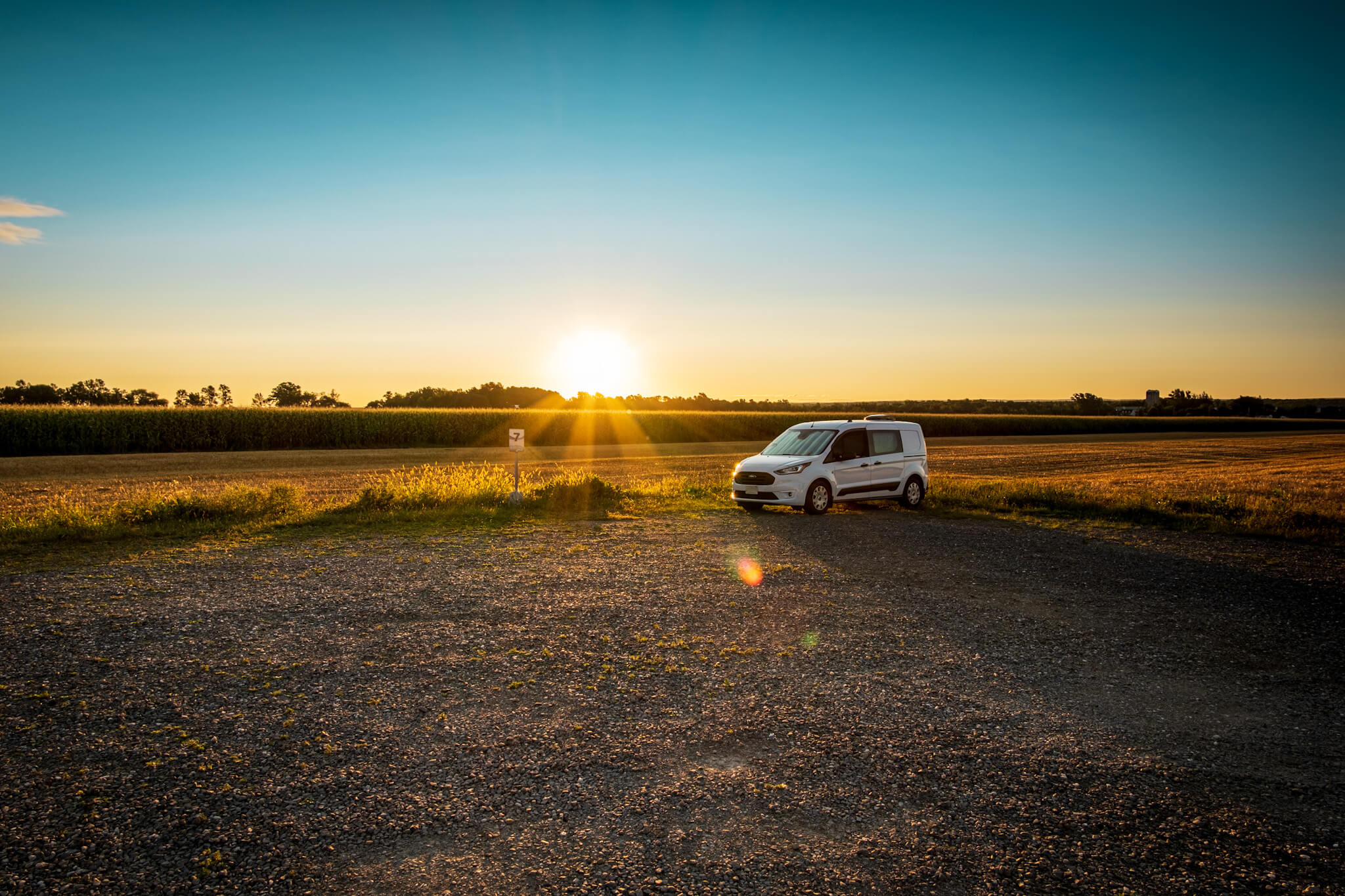 Transit Connect van in the RV stop at sunrise in Berthier-sur-Mer, Quebec