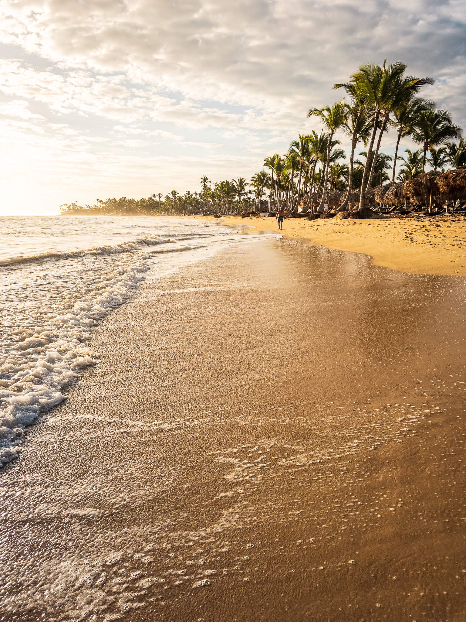Enjoying a morning walk on the beach at Excellence El Carmen in Punta Cana