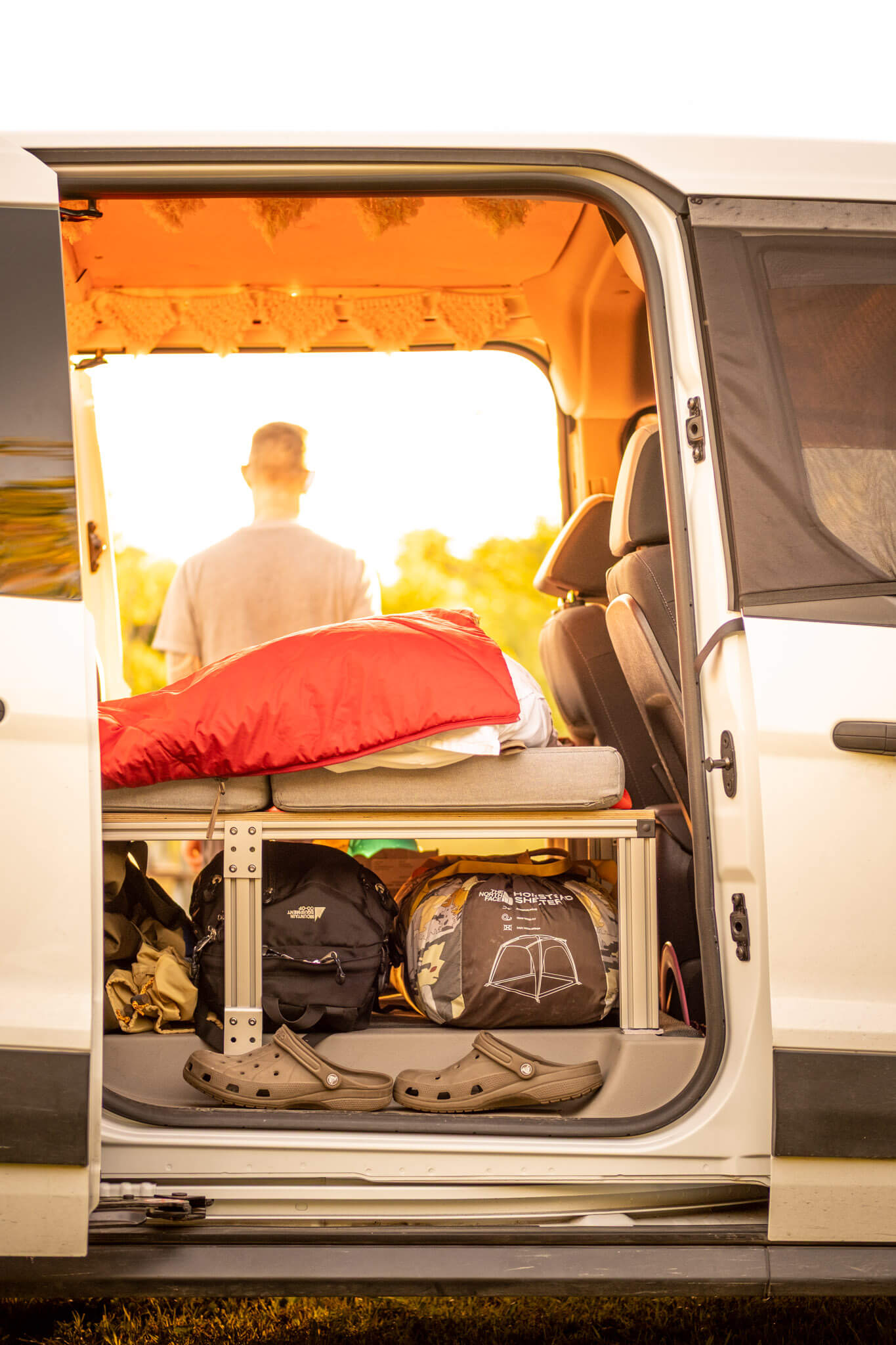 Looking inside the side door of a Transit Connect camper van conversion