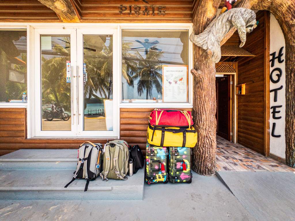 Several pieces of luggage in front of a hotel in Roatan, Honduras