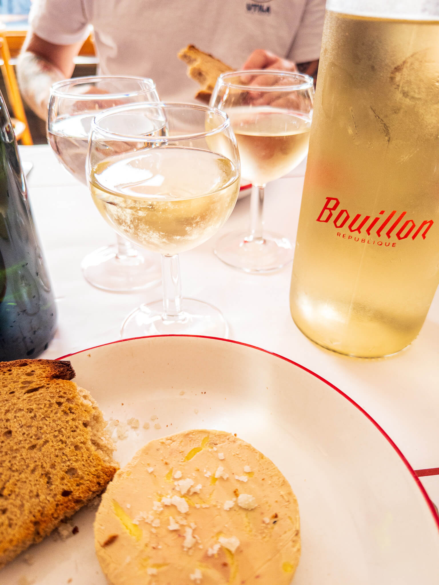 The foie gras appetizer paired with white wine at Bouillon Pigalle in Montmartre, Paris
