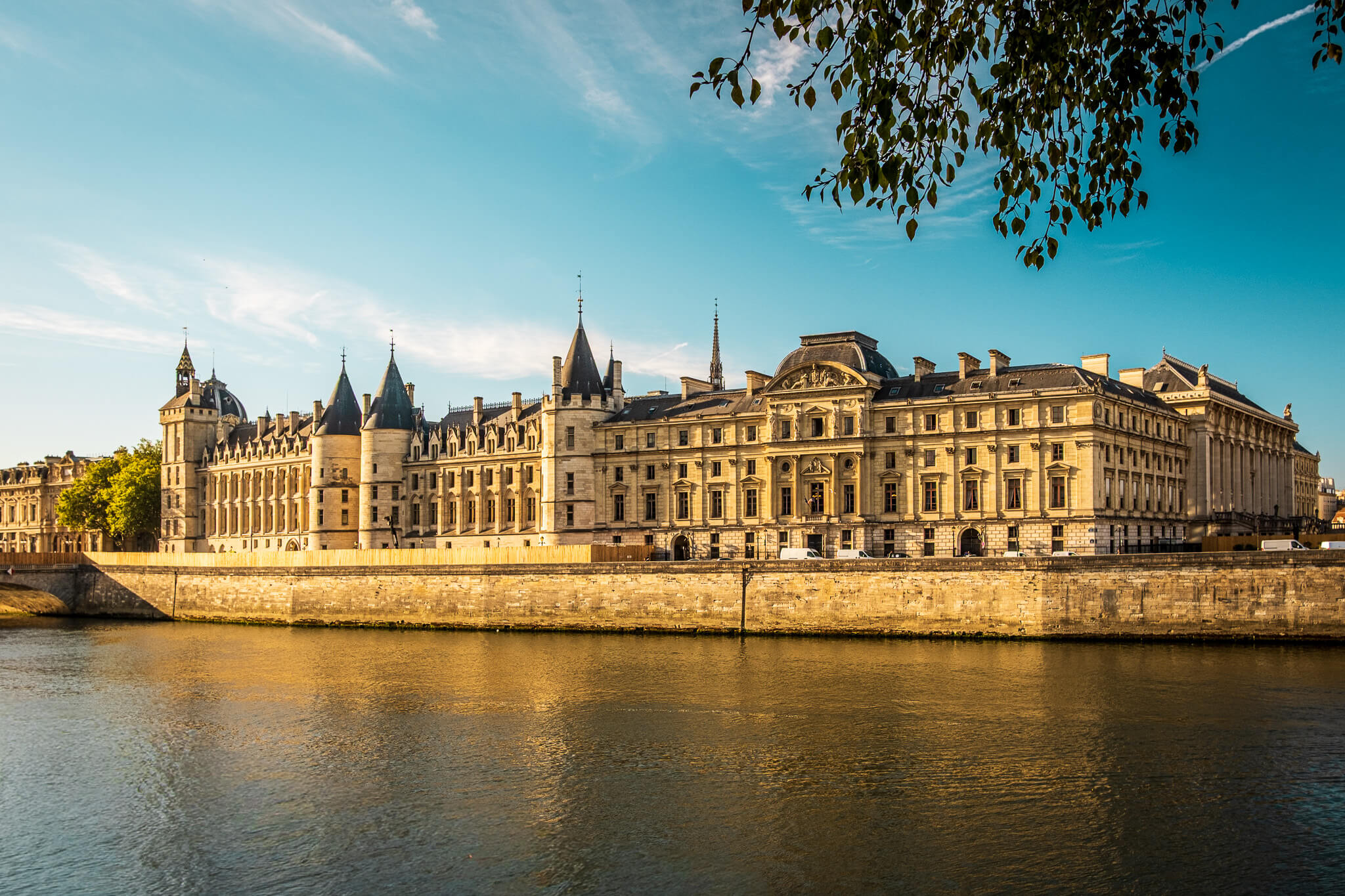 The exterior of the Conciergerie on the Seine river in Paris