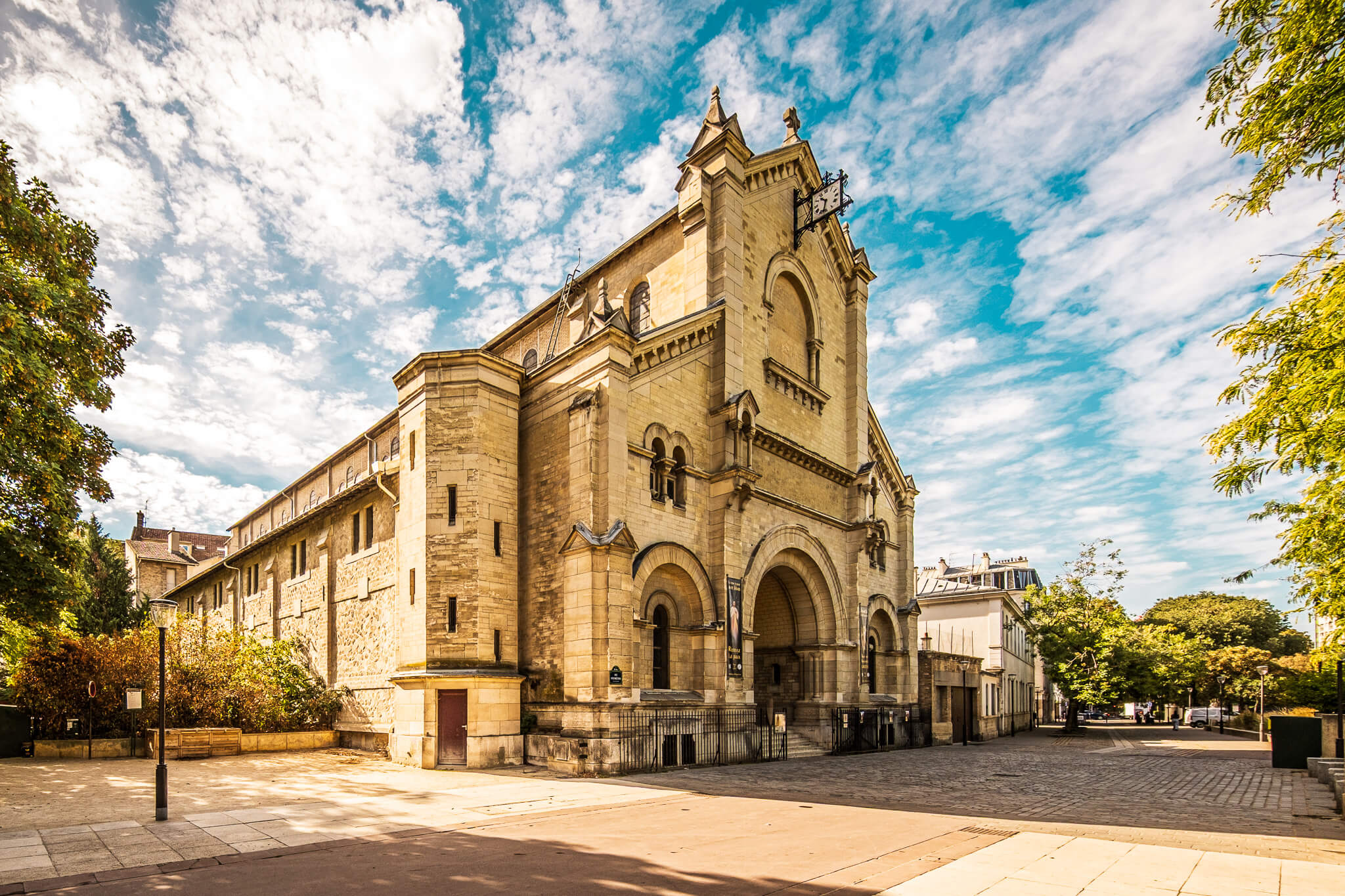The Neo-Romanesque exterior of Église Notre-Dame-du-Travail in Paris