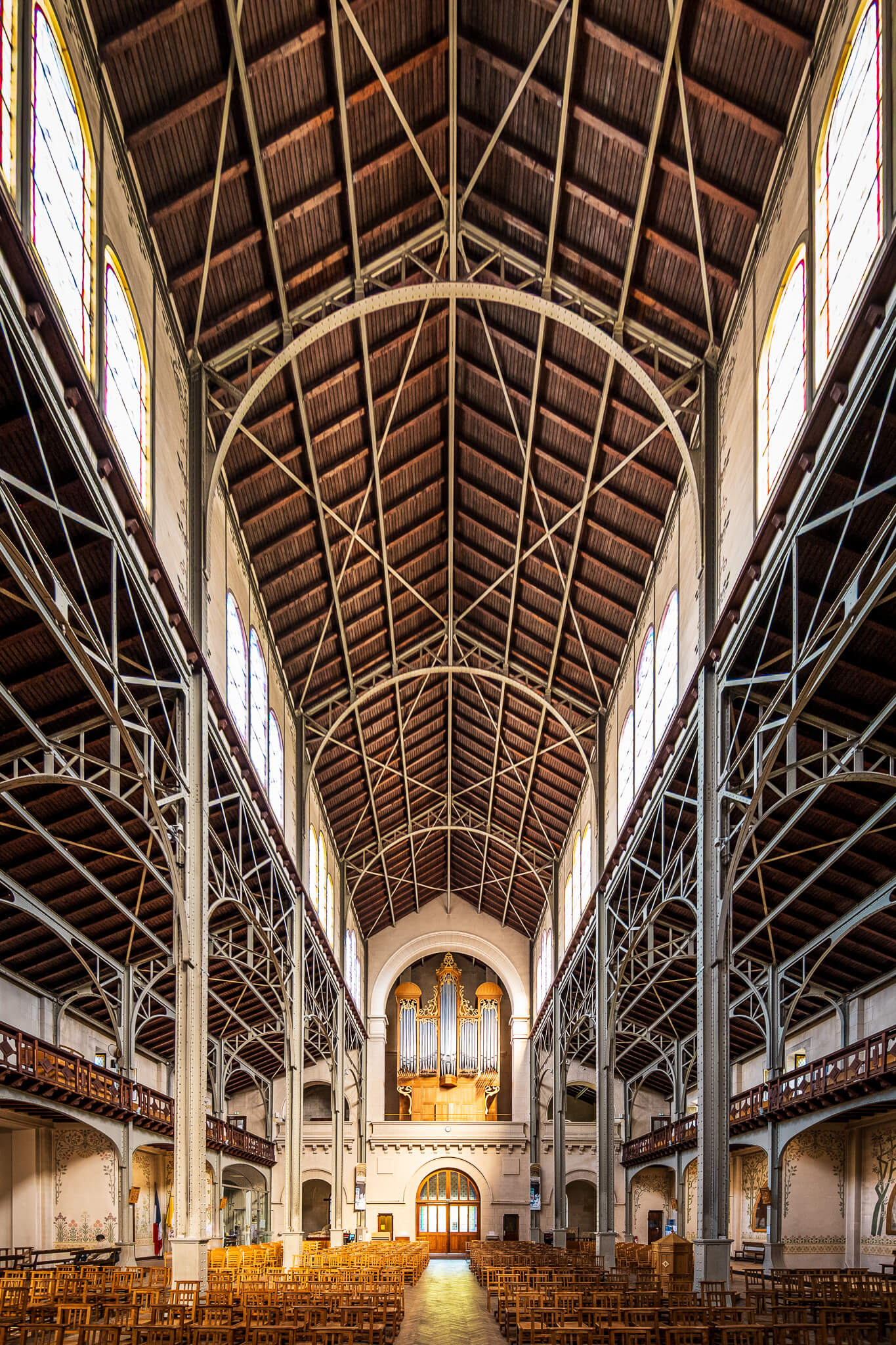 The metal-framed interior of Église Notre-Dame-du-Travail in Paris