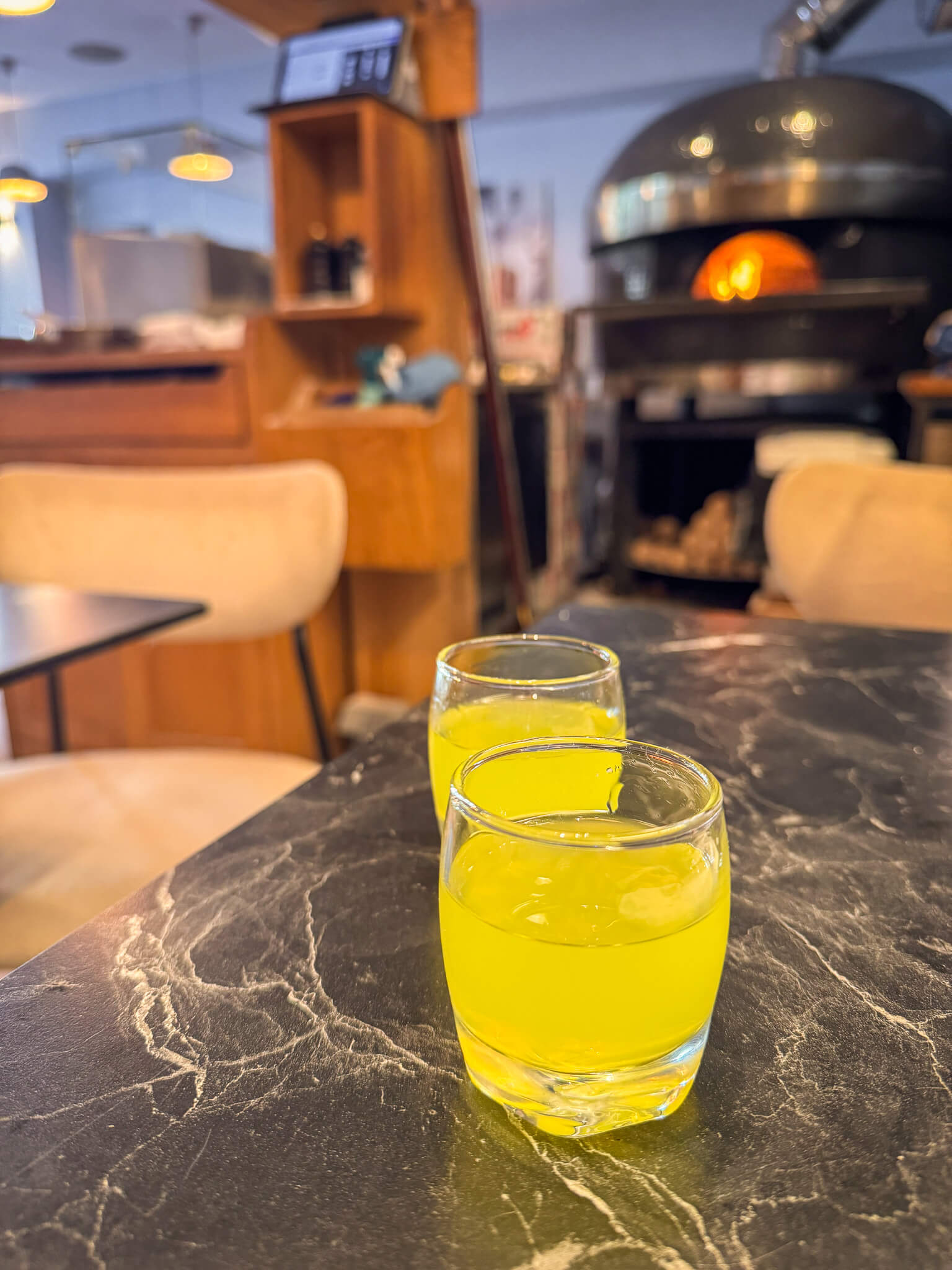 Two glasses of limoncello after a pizza lunch at Guillaume Grasso's La Vera Pizza Napoletana