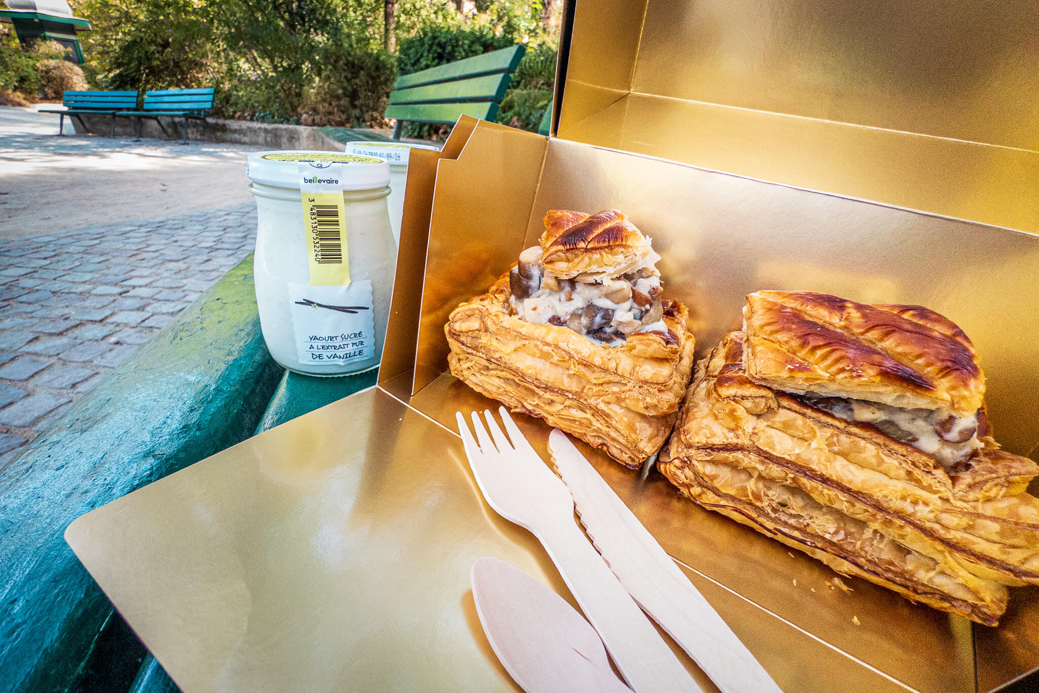 A picnic lunch of vol-au-vent and vanilla yogurt in a Parisian park